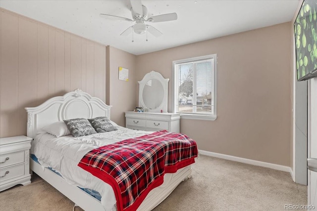 bedroom featuring light colored carpet and ceiling fan