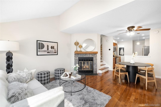 7373 E Iowa Ave Unit 1124, Denver, CO 80231 - living room featuring dark wood-type flooring, ceiling fan, a fireplace, recessed lighting, and lofted ceiling