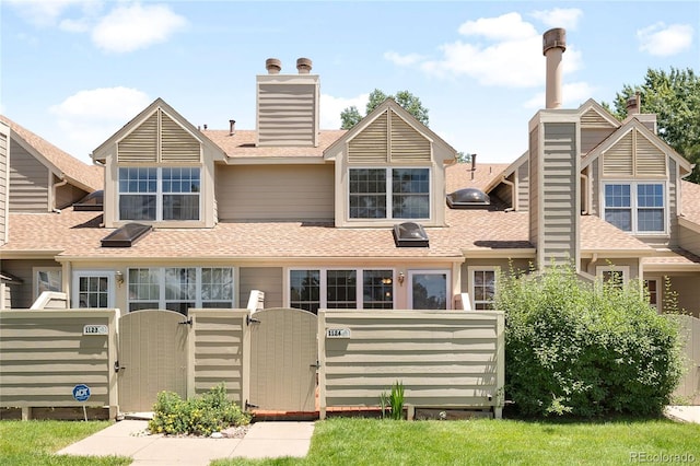 7373 E Iowa Ave Unit 1124, Denver, CO 80231 - rear view of house featuring a gate, a chimney, and a shingled roof
