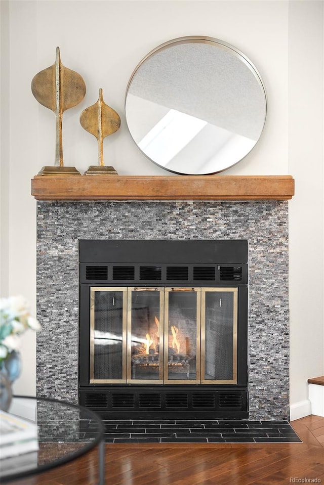 7373 E Iowa Ave Unit 1124, Denver, CO 80231 - detailed view of wood finished floors and a glass covered fireplace