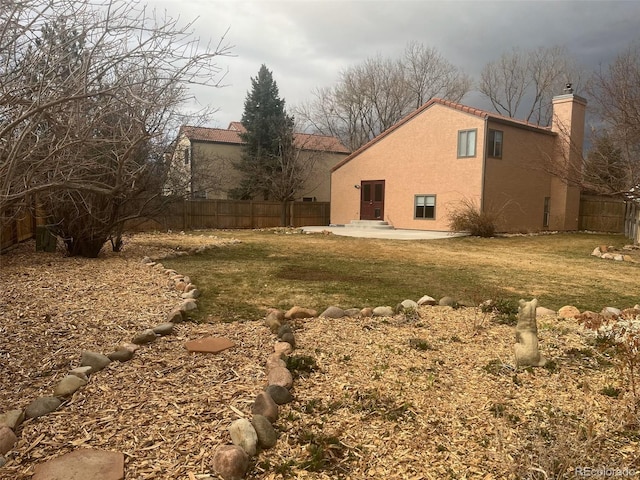 view of yard with a fenced backyard and a patio area