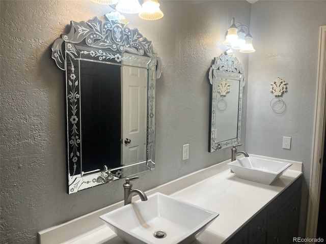 full bathroom with a sink and a textured wall