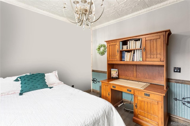 1124 E Poncha Ave, Poncha Springs, CO 81242 - bedroom featuring a chandelier, dark wood-style floors, wainscoting, a desk, and crown molding