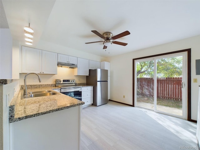 kitchen featuring light stone counters, sink, ceiling fan, appliances with stainless steel finishes, and white cabinets