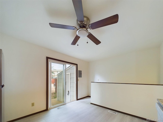 unfurnished room featuring ceiling fan and light hardwood / wood-style flooring