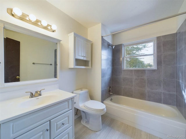 full bathroom with vanity, toilet, and tiled shower / bath