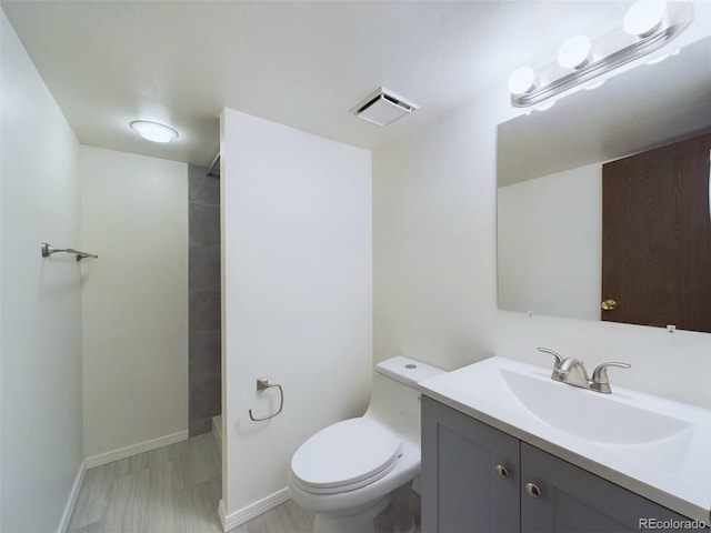 full bathroom with vanity, toilet, hardwood / wood-style floors, and tub / shower combination