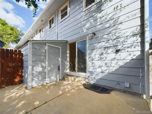 view of side of property featuring a patio area