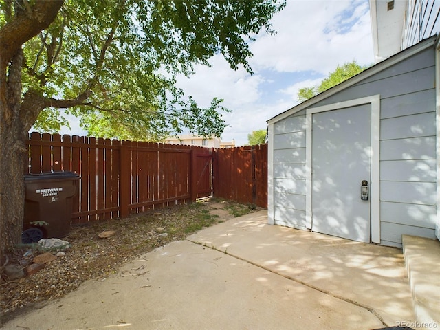 view of patio featuring a storage shed