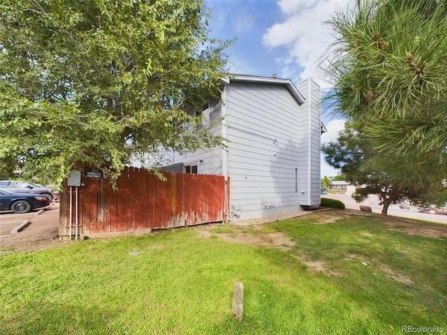 view of home's exterior featuring a yard