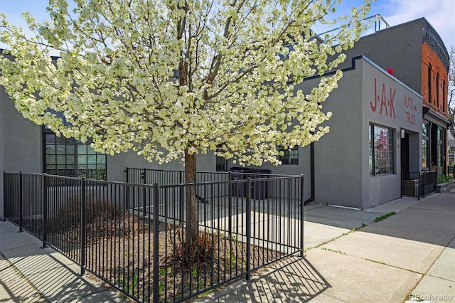 117 Elati St Unit 1, Denver, CO 80223 - view of property exterior with stucco siding