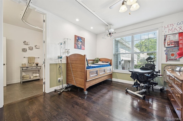 bedroom with hardwood / wood-style floors