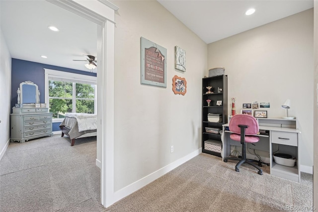 office space with ceiling fan and light colored carpet