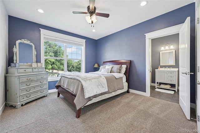 bedroom with carpet, ceiling fan, and sink