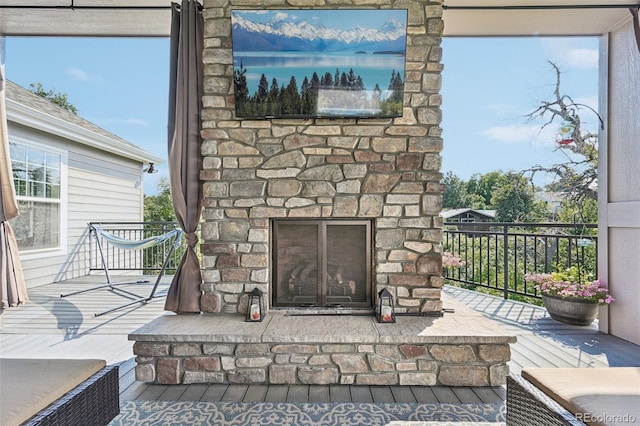 details featuring an outdoor stone fireplace