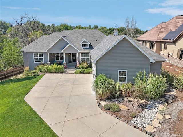 view of front of property featuring a porch and a front lawn