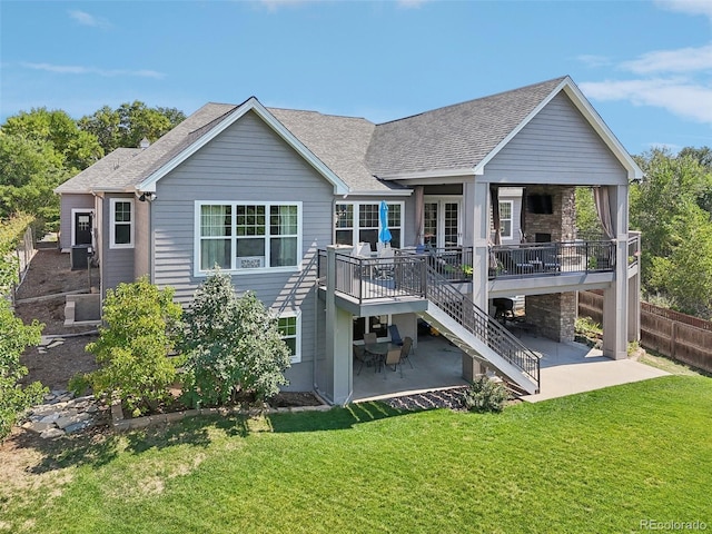 back of house featuring a yard, a patio, and a deck