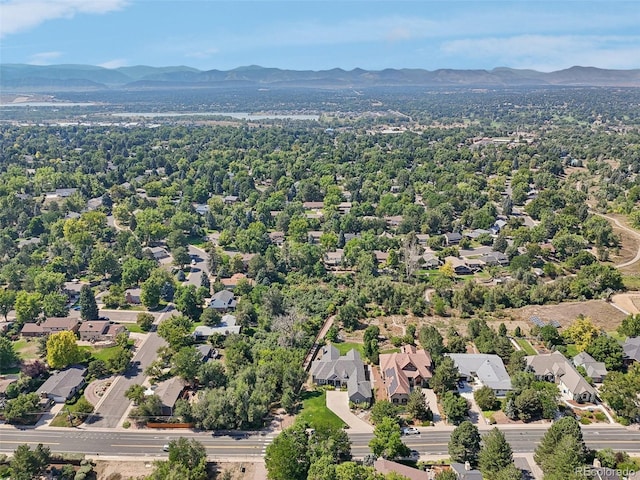 birds eye view of property with a mountain view