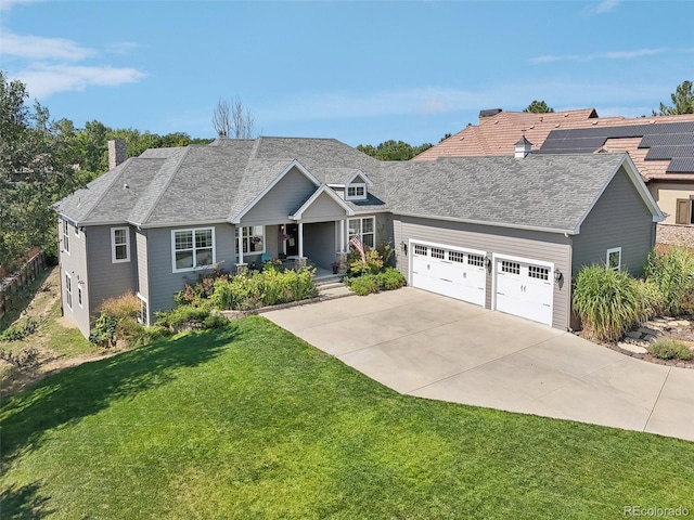 view of front of property featuring a porch, a garage, and a front lawn