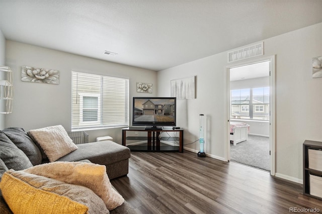 living room featuring dark hardwood / wood-style floors