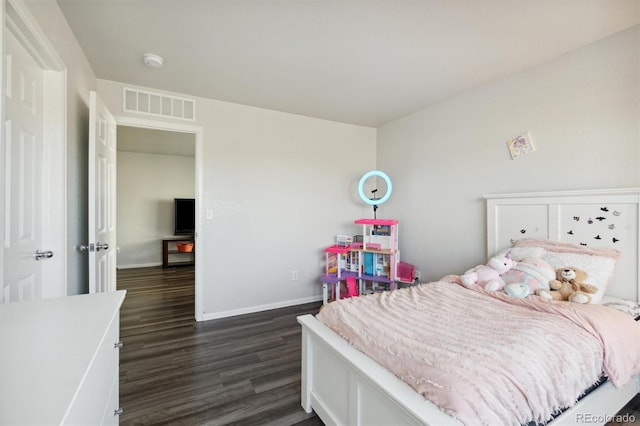 bedroom featuring dark hardwood / wood-style flooring