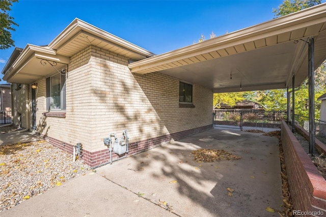 view of home's exterior with a carport