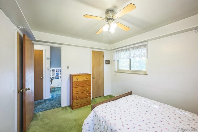 carpeted bedroom with ceiling fan