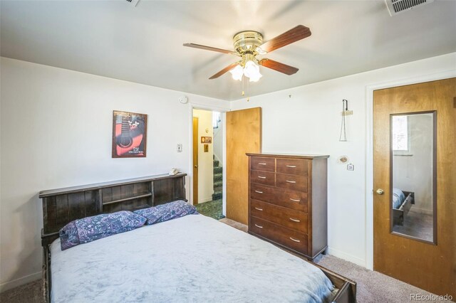 carpeted bedroom featuring ceiling fan