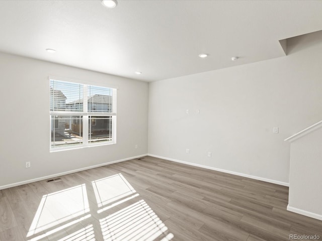 unfurnished room featuring wood-type flooring