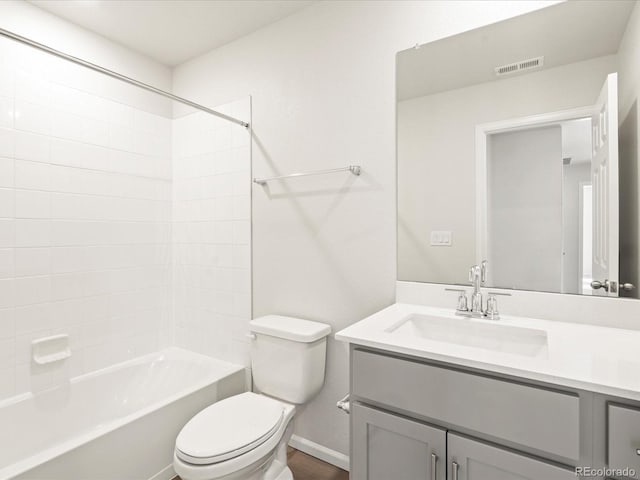 full bathroom featuring shower / tub combination, vanity, and toilet