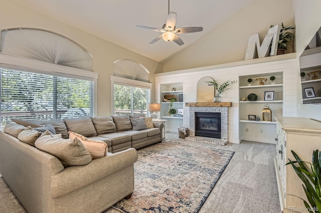 10155 Silver Maple Cir, Highlands Ranch, CO 80129 - carpeted living room featuring a ceiling fan, vaulted ceiling, a brick fireplace, and built in shelves