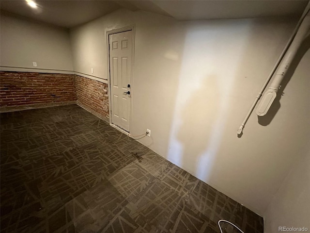 26 E Jewell Ave, Denver, CO 80210 - hallway featuring brick wall