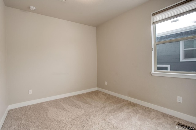 empty room featuring carpet floors