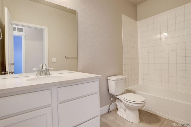 full bathroom featuring toilet, tile patterned flooring, tiled shower / bath combo, and vanity