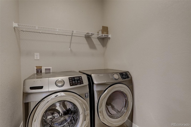 washroom featuring separate washer and dryer