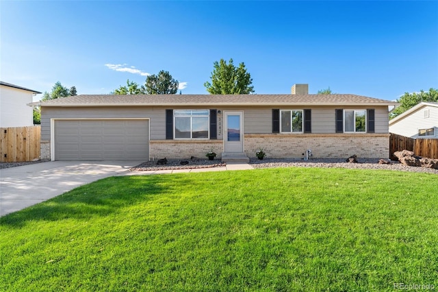 3082 S Laredo Cir, Aurora, CO 80013 - ranch-style home featuring brick siding, an attached garage, concrete driveway, and a chimney