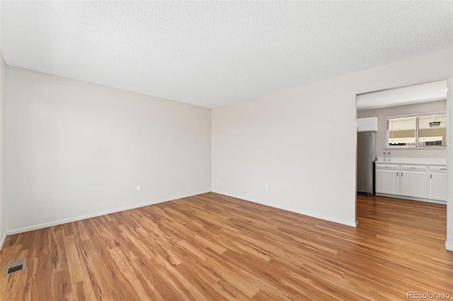3082 S Laredo Cir, Aurora, CO 80013 - empty room featuring light wood-style flooring