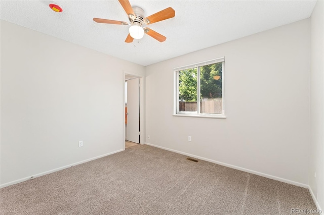 3082 S Laredo Cir, Aurora, CO 80013 - spare room featuring carpet and a ceiling fan