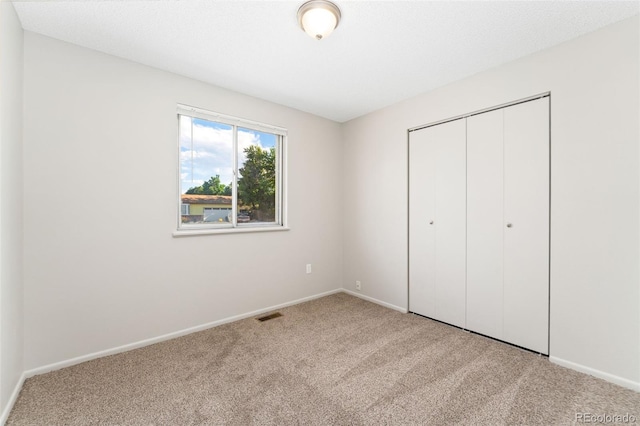 3082 S Laredo Cir, Aurora, CO 80013 - unfurnished bedroom featuring carpet floors and a closet