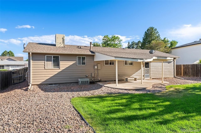 3082 S Laredo Cir, Aurora, CO 80013 - back of house featuring a fenced backyard, a patio area, and a chimney