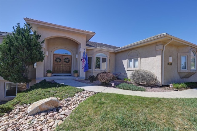 6240 Wilson Rd, Colorado Springs, CO 80919 - view of front of property featuring stucco siding and a front yard