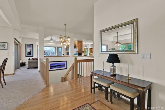6240 Wilson Rd, Colorado Springs, CO 80919 - dining space with a chandelier, a ceiling fan, and baseboards