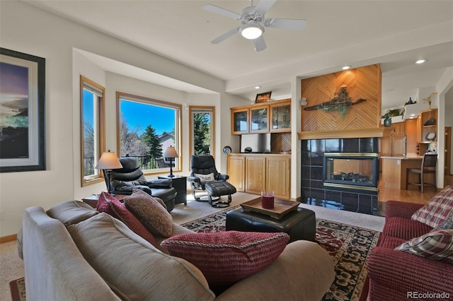 6240 Wilson Rd, Colorado Springs, CO 80919 - carpeted living room with healthy amount of natural light, recessed lighting, ceiling fan, a fireplace, and baseboards