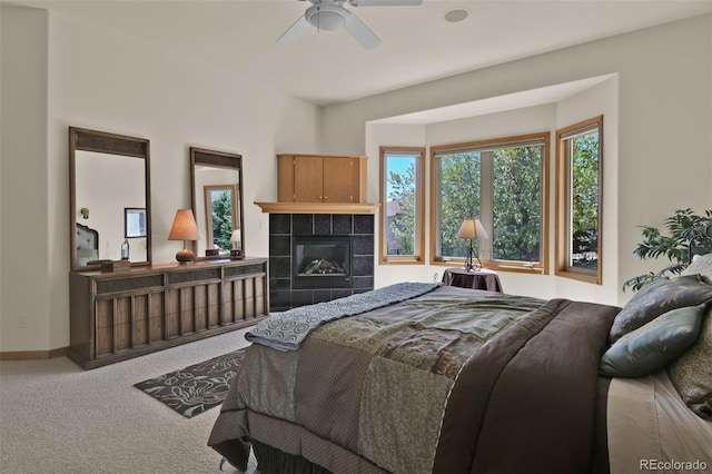 6240 Wilson Rd, Colorado Springs, CO 80919 - carpeted bedroom with a tile fireplace and baseboards