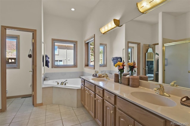6240 Wilson Rd, Colorado Springs, CO 80919 - full bathroom with healthy amount of natural light, tile patterned floors, a bath, a stall shower, and recessed lighting