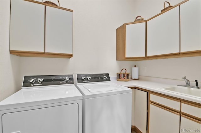 6240 Wilson Rd, Colorado Springs, CO 80919 - clothes washing area with cabinet space and independent washer and dryer