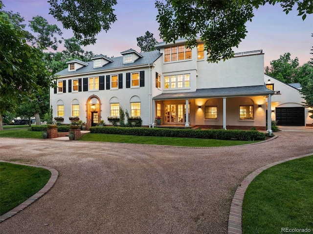 view of front of home featuring a lawn and covered porch