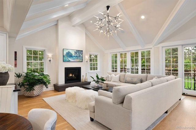 living room with beamed ceiling, light hardwood / wood-style flooring, high vaulted ceiling, and french doors