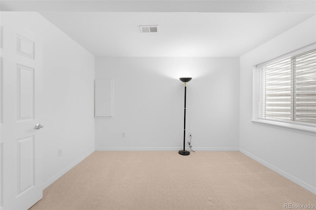 6658 S Shawnee Ct, Aurora, CO 80016 - spare room featuring light carpet and baseboards