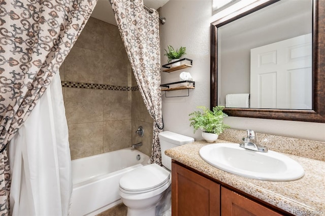 full bathroom with vanity, shower / bath combo, and toilet